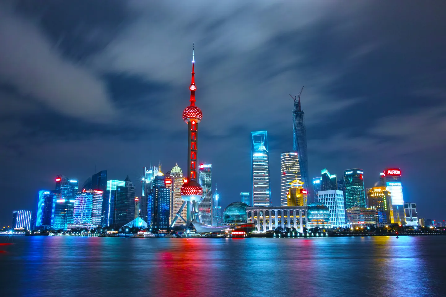 The illuminated Shanghai skyline beside the Huangpu River